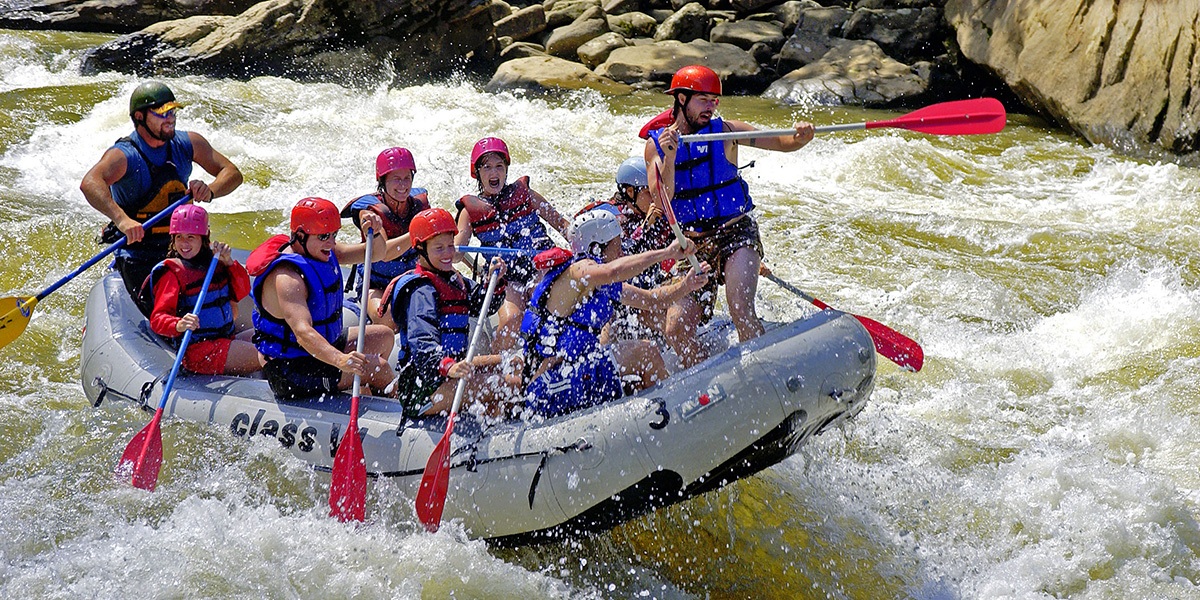 A group of people white water rafting in West Virginia. 
